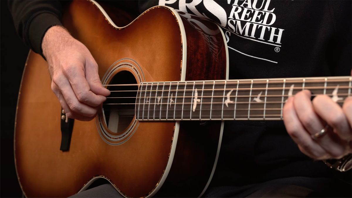 Bryan Ewald holding PRS Acoustic